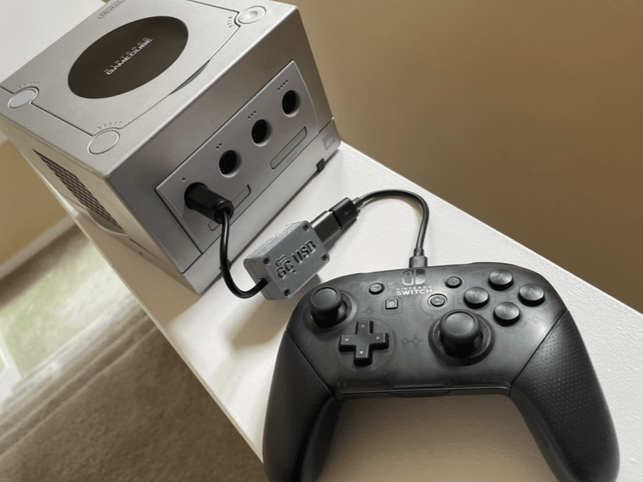 Joypad USB2GC adapter connecting a Switch Pro Controller to a GameCube